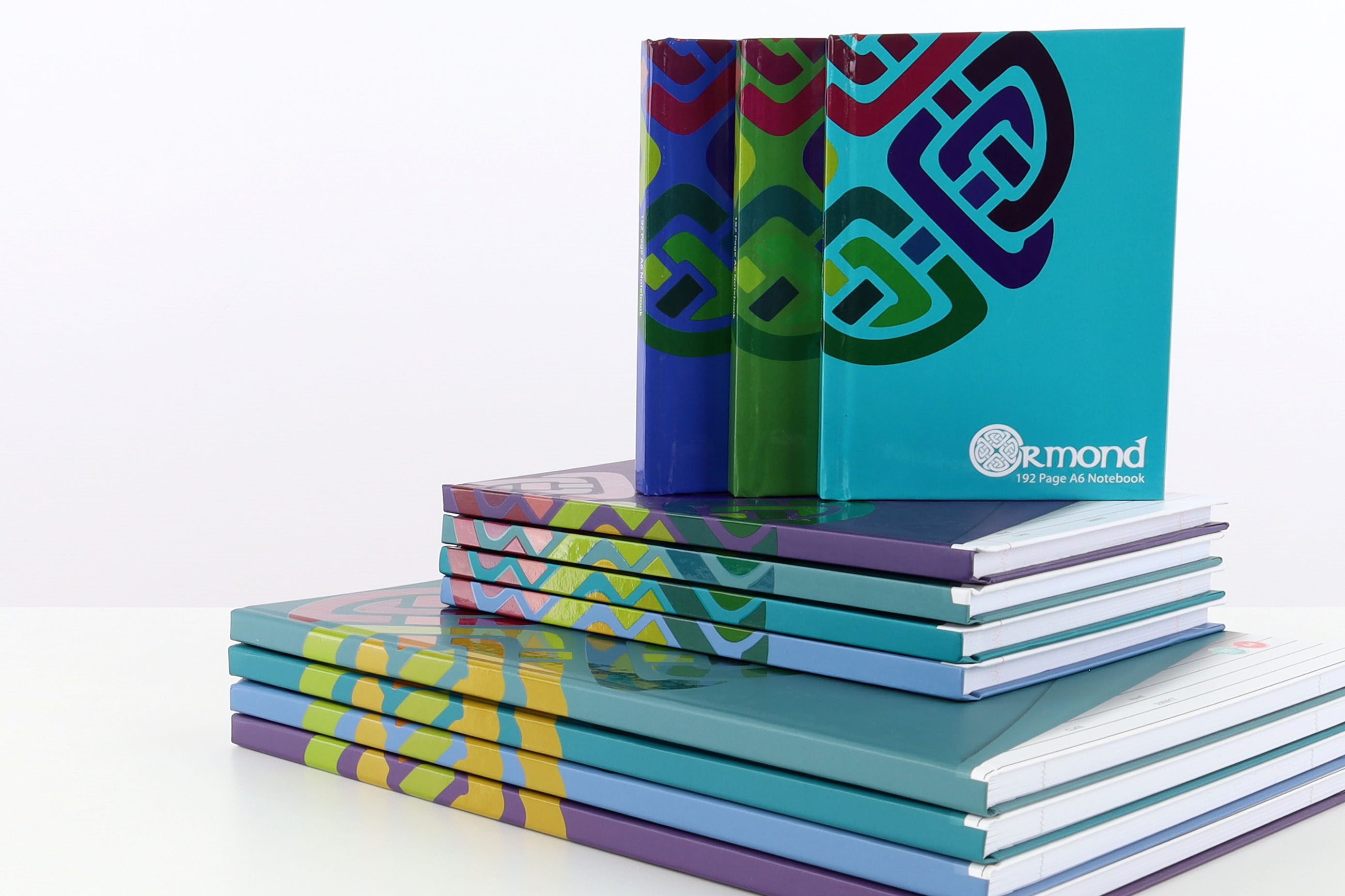 Stack of Hardcover Ormond Notebooks in various sizes